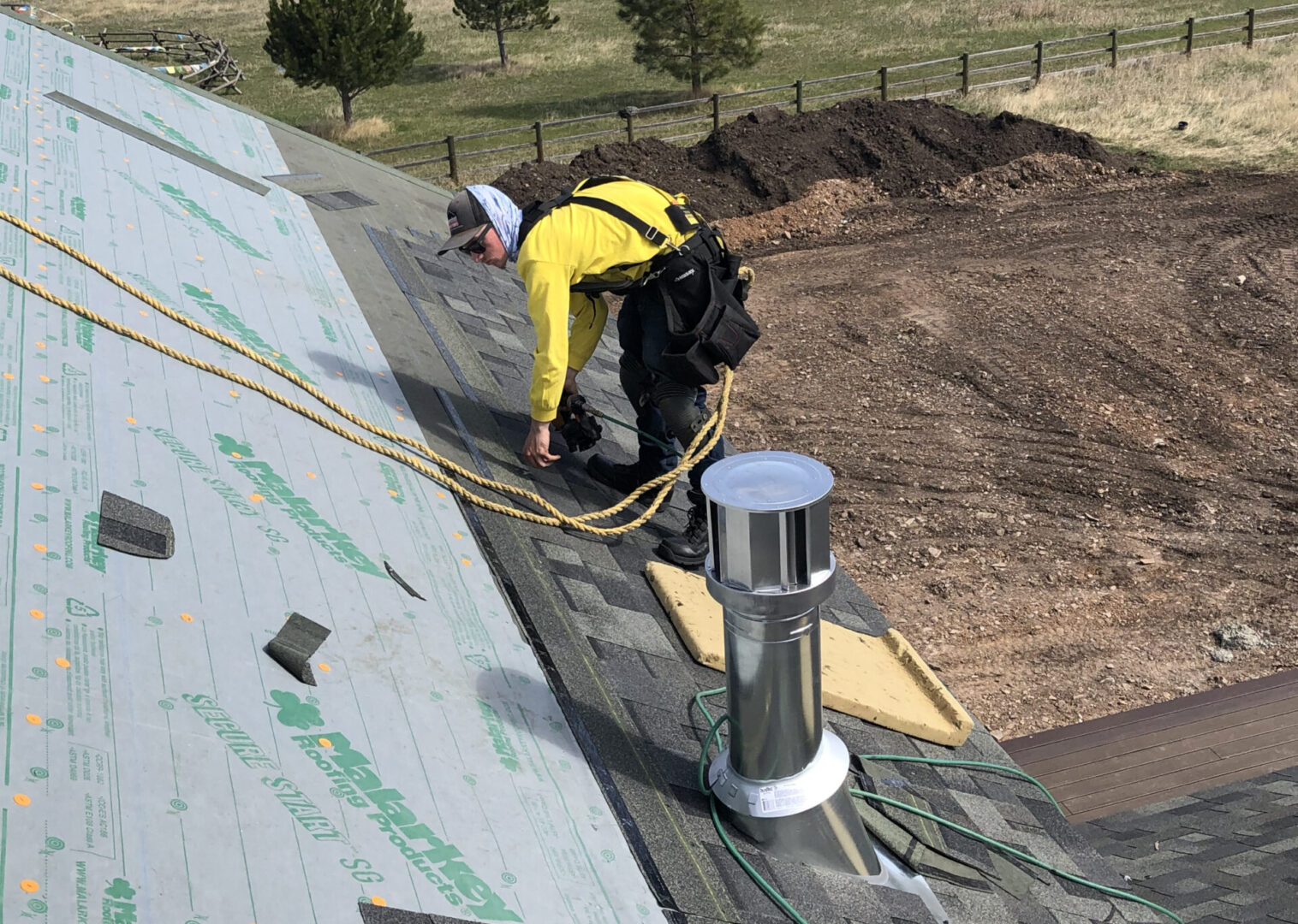 Completed residential roof with chimneys