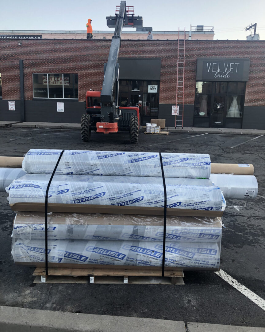 Rolled roofing membrane staged at a downtown Missoula commercial job